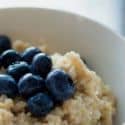 A bowl of oatmeal with blueberries