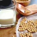 A glass of soy milk with soybeans