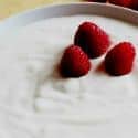 Plain yogurt with a raspberry