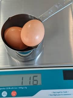 Image of 2 boiled eggs in a cup