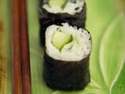 Photo of a Sushi Roll wrapped in Dried Seaweed (Nori)